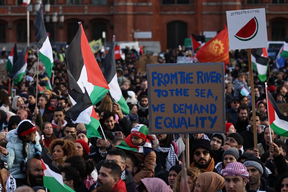 epa10957589 A protester holds a placard reading 'From the river to the sea, we demand equality', during a protest in solidarity with Palestinians, in Berlin, Germany, 04 November 2023. The rally in the inner city of Berlin was held under the motto 'Free Palestine will not be cancelled!'. Thousands of Israelis and Palestinians have died since the militant group Hamas launched an unprecedented attack on Israel from the Gaza Strip on 07 October, and the Israeli strikes on the Palestinian enclave which followed it.  EPA/CLEMENS BILAN