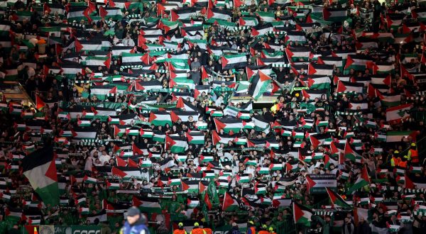 epa10939019 Supporters of Celtic wave Palestinian flags before the UEFA Champions League Group E match between Celtic Glasgow and Atletico Madrid in Glasgow, Britain, 25 October 2023.  EPA/ROBERT PERRY