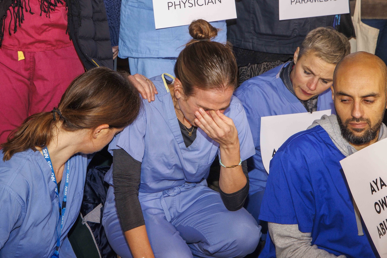epa10968918 A healthcare worker reacts during a vigil to call for a ceasefire in Gaza, at Downing Street, London, Britain, 10 November 2023.  More than 11,000 Palestinians and at least 1,400 Israelis have been killed, according to the Israel Defense Forces (IDF) and the Palestinian health authority, since Hamas militants launched an attack against Israel from the Gaza Strip on 07 October, and the Israeli operations in Gaza and the West Bank which followed it.  EPA/Mark Thomas