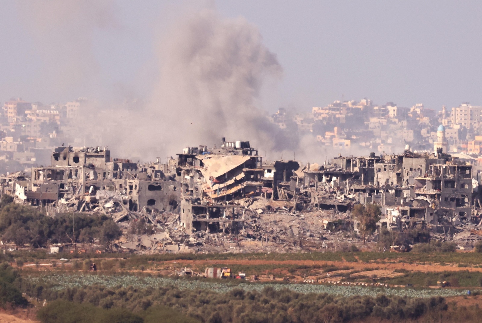 epa10969361 Smoke billows from ruined buildings in the northern part of the Gaza Strip, as seen from Sderot, Israel, 11 November 2023. More than 11,000 Palestinians and at least 1,200 Israelis have been killed, according to the Israel Defense Forces (IDF) and the Palestinian health authority, since Hamas militants launched an attack against Israel from the Gaza Strip on 07 October, and the Israeli operations in Gaza and the West Bank which followed it.  EPA/NEIL HALL