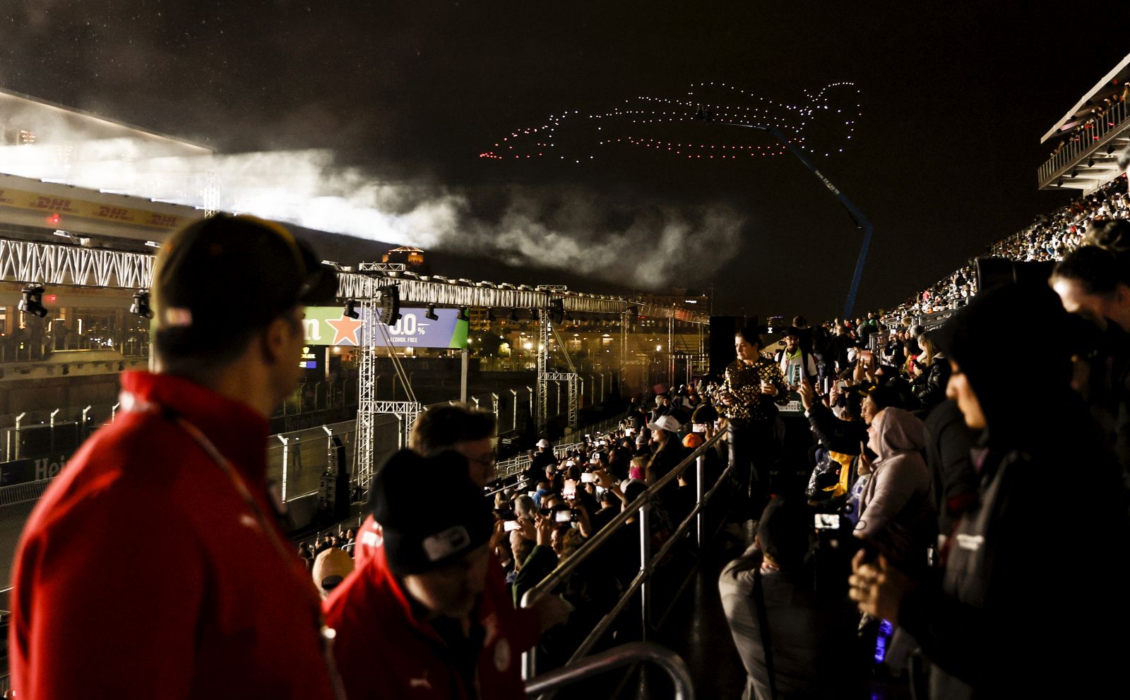 epa10977655 Drones form the silhouette of a F1 car during the opening ceremony ahead of the F1 Grand Prix of Las Vegas at the Las Vegas Strip Circuit in Las Vegas, Nevada, USA, 15 November 2023.  EPA/ETIENNE LAURENT