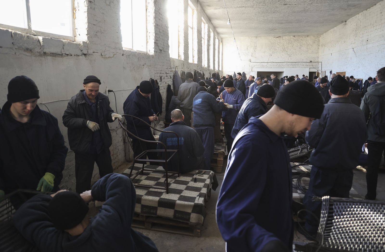 epa10979285 Russian prisoners of war make furniture inside a detention center at an undisclosed location in the Lviv region, western Ukraine, 16 November 2023. Russia and Ukraine have been accusing each other of abusing and mistreating their respective prisoners of war, prompting a UN investigation in early 2023. A new camp will be opened for Russian prisoners of war in Ukraine due to the large number of them, the head of the Ministry of Justice, Denys Malyuska, announced 16 November. About 10,000 UAH (~250 EUR) per month are spent on the maintenance of one Russian soldier captured by Ukraine, the Ministry of Justice reported in the spring of 2023. Russian troops entered Ukrainian territory in February 2022, starting a conflict that has provoked destruction and a humanitarian crisis.  EPA/YAKIV LIASHENKO  ATTENTION: This Image is part of a PHOTO SET