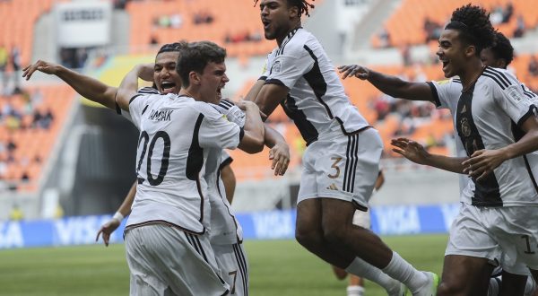 epa10982063 Robert Ramsak of Germany (L) celebrates with his team mates after scoring the opening goal during the FIFA U-17 World Cup group stage match between Germany and Venezuela at the Jakarta International Stadium in Jakarta, Indonesia, 18 November 2023.  EPA/BAGUS INDAHONO