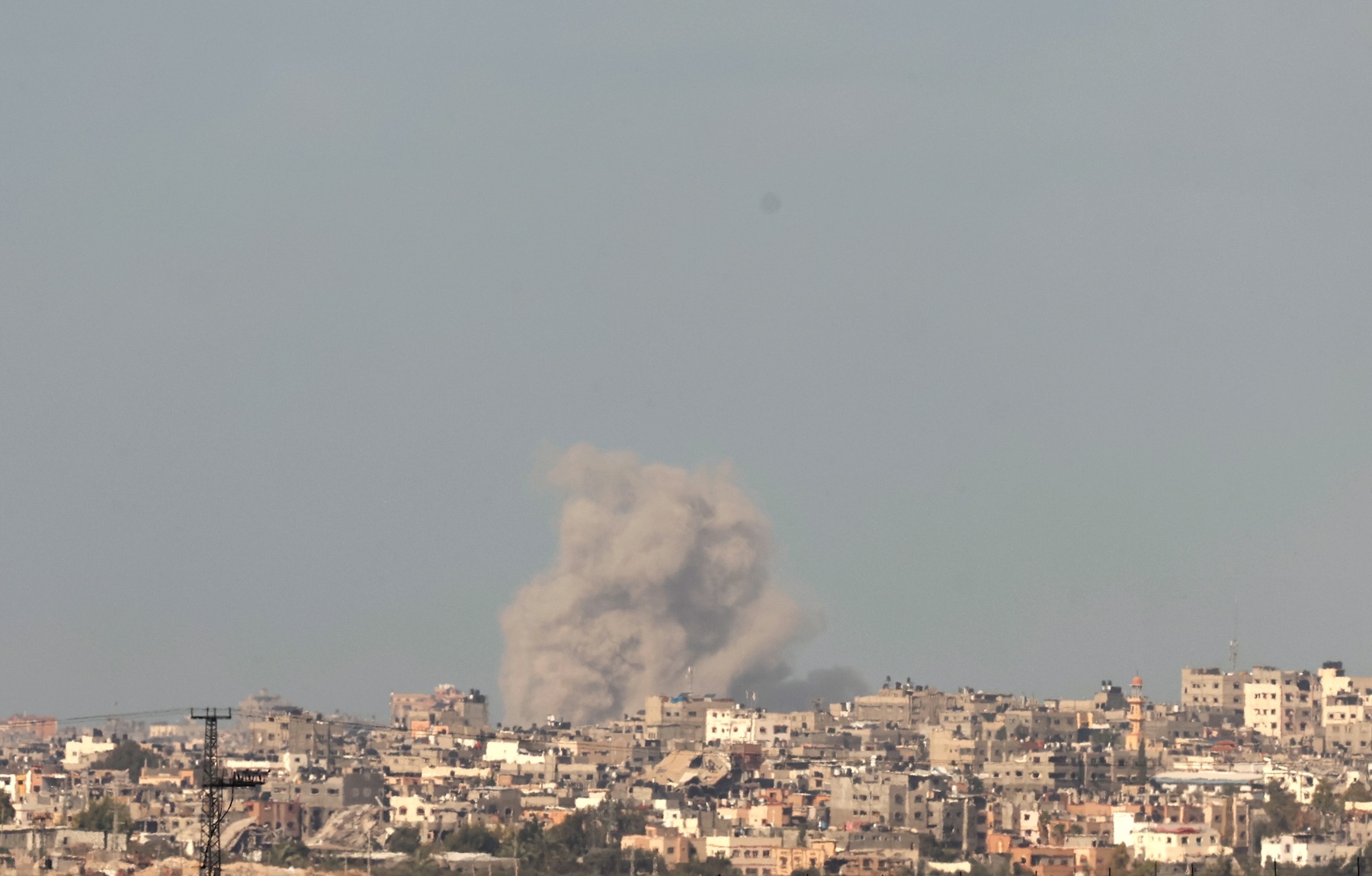 epa10988278 An Israeli Navy ship (R) sails on the horizon as smoke rises after an explosion on the outskirts of Gaza city, as seen from Be'eri, southern Israel, 21 November 2023. As part of Israel's 'ground operations' in the Gaza Strip, Israeli military aircraft struck approximately 250 Hamas targets over the last day, the IDF announced on 21 November. More than 12,500 Palestinians and at least 1,200 Israelis have been killed, according to the Israel Defense Forces (IDF) and the Palestinian health authority, since Hamas militants launched an attack against Israel from the Gaza Strip on 07 October, and the Israeli operations in Gaza and the West Bank which followed it.  EPA/ATEF SAFADI