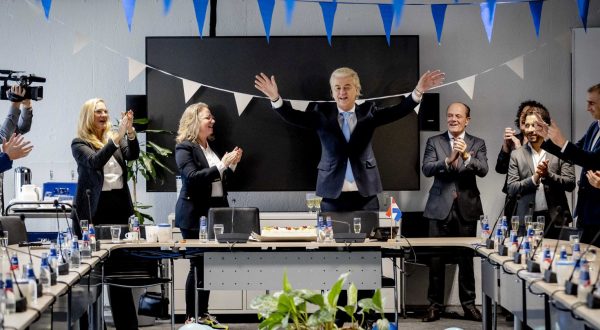 epa10990601 Leader of Freedom party (PVV) Geert Wilders (C-R) gestures next to Dutch MP Fleur Agema (C-L) one day after the House of Representatives elections, The Hague, Netherlands, 23 November 2023. Wilders believes that the PVV can no longer be ignored after the "mega victory" in the House of Representatives elections. He calls on other parties to work together and step over their own shadows. The PVV party is set to win the parliamentary elections with 37 seats after most votes were counted.  EPA/REMKO DE WAAL