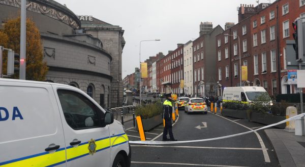 epa10991096 Police officers stand near the scene following a serious incident near Parnell Street East in Dublin, Ireland, 23 November 2023. A man has been detained after allegedly five people, among them three children, near a school in central Dublin, police said.  EPA/MOSTAFA DARWISH