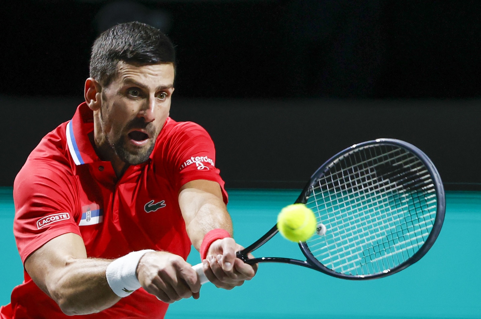 epa10991538 Novak Djokovic of Serbia in action against Cameron Norrie of Great Britain during their singles match of the Davis Cup quarter final tie between Serbia and Great Britain in Malaga, Spain, 23 November 2023.  EPA/Jorge Zapata