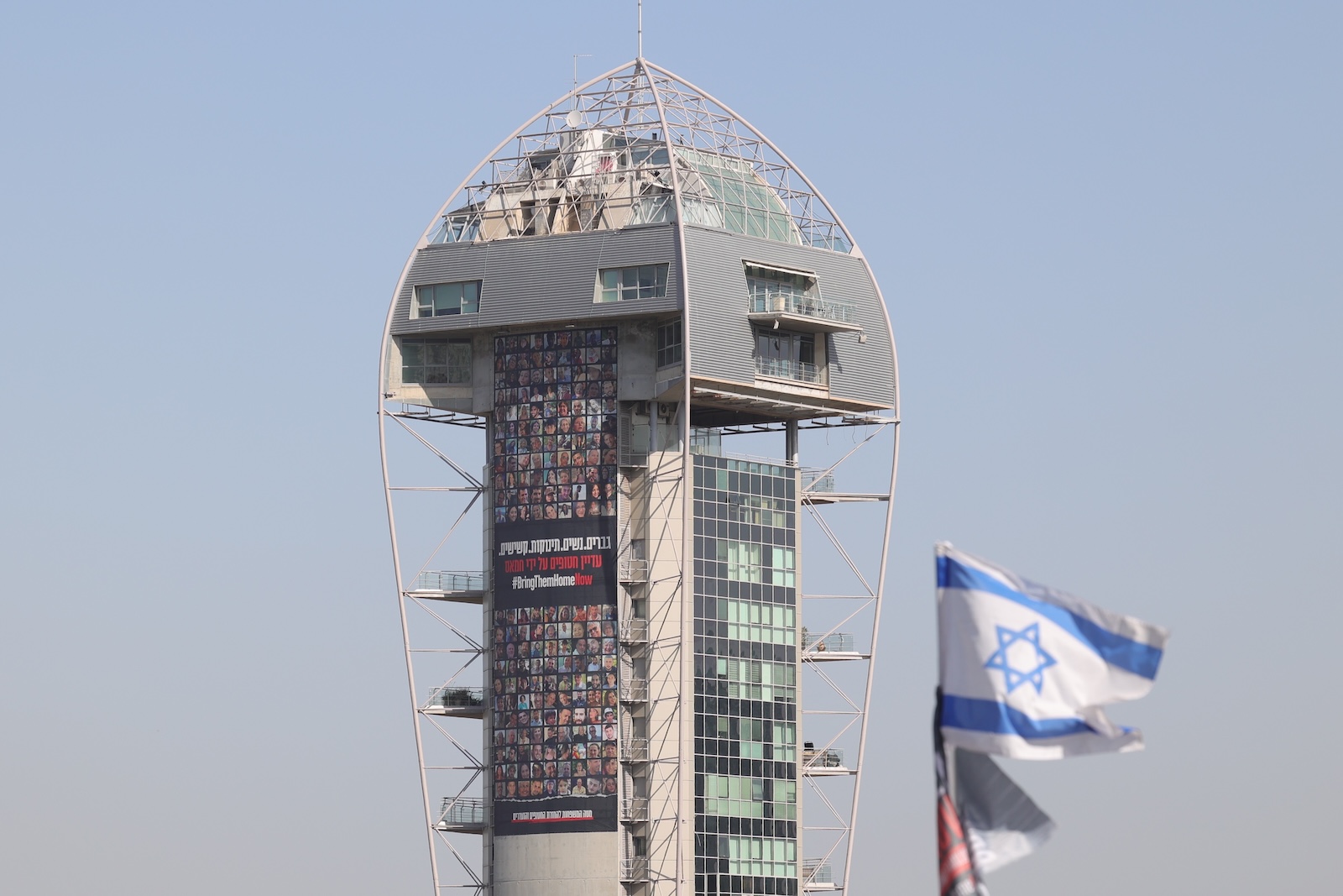 epa10992105 A large billboard showing minor Israeli hostages being held by Hamas in Gaza, on display in Tel Aviv, Israel, 24 November 2023. Israel and Hamas agreed to a 4-day ceasefire agreement, mediated by Qatar, the US, and Egypt, that came into effect at 05:00 AM GMT on 24 November, with 50 Israeli hostages, women and children, to be released by Hamas. 150 Palestinian women and children that were detained in Israeli prisons are to be released in exchange. More than 14.000 Palestinians and at least 1,200 Israelis have been killed, according to the Gaza Government media office and the Israel Defense Forces (IDF), since Hamas militants launched an attack against Israel from the Gaza Strip on 07 October, and the Israeli operations in Gaza and the West Bank which followed it.  EPA/ABIR SULTAN