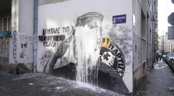 10, November, 2021, Belgrade - A bucket of lime was thrown on the mural with the image of Ratko Mladic, and behind it stands Djordjo Zujovic, a longtime activist and member of the Social Democratic Party of Serbia.   10, novembar, 2021, Beograd  - Na mural sa likom Ratka Mladica bacena je kofa kreca, a iza toga stoji Djordjo Zujovic, dugogodisnji aktivista i clan Socijaldemokratske partije Srbije.  Photo: Antonio Ahel/PIXSELL