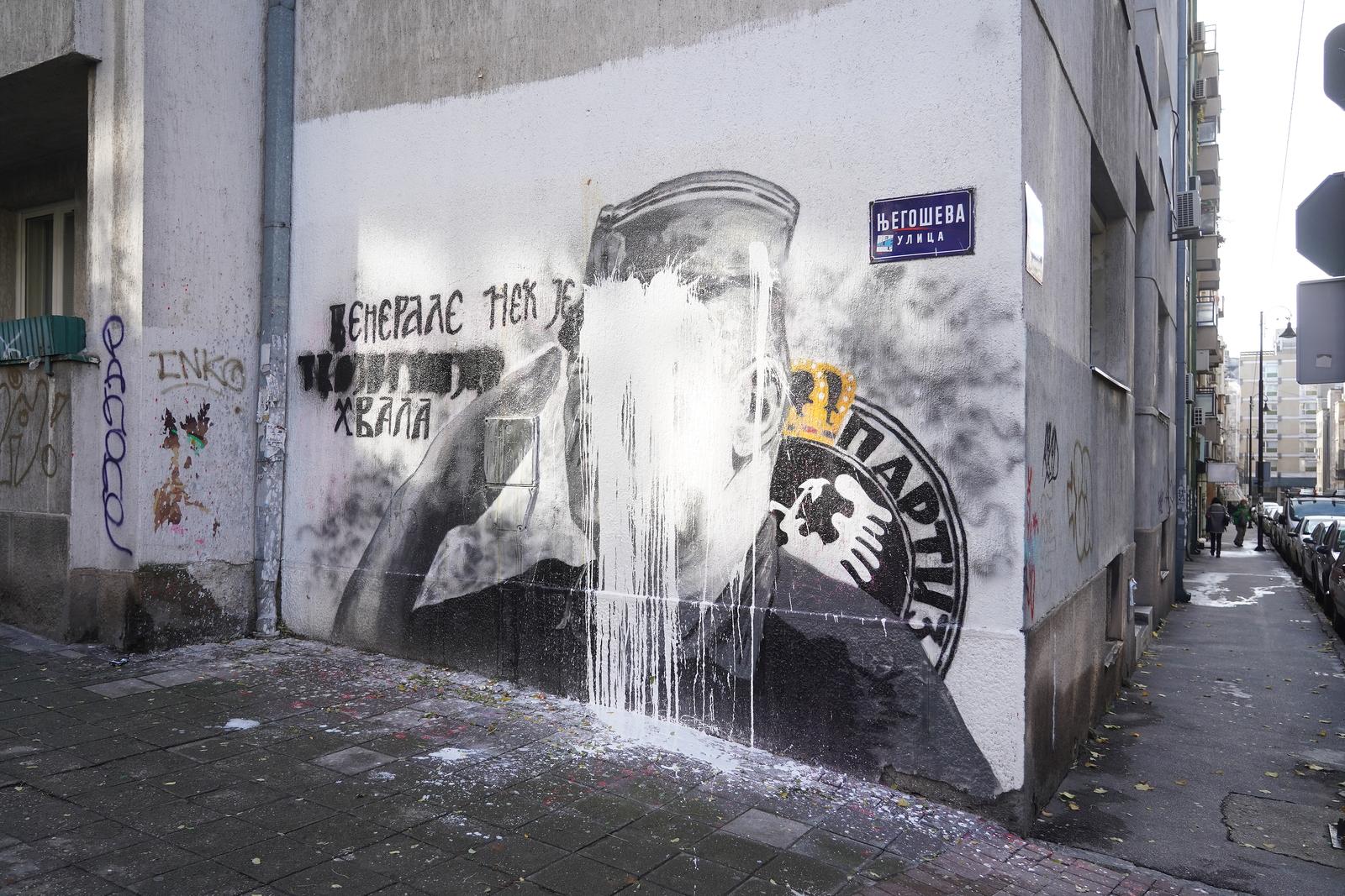 10, November, 2021, Belgrade - A bucket of lime was thrown on the mural with the image of Ratko Mladic, and behind it stands Djordjo Zujovic, a longtime activist and member of the Social Democratic Party of Serbia.   10, novembar, 2021, Beograd  - Na mural sa likom Ratka Mladica bacena je kofa kreca, a iza toga stoji Djordjo Zujovic, dugogodisnji aktivista i clan Socijaldemokratske partije Srbije.  Photo: Antonio Ahel/PIXSELL