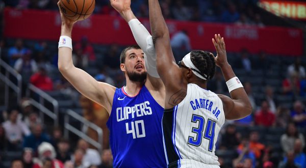 Oct 31, 2023; Los Angeles, California, USA;  Los Angeles Clippers center Ivica Zubac (40) shoots against Orlando Magic center Wendell Carter Jr. (34) during the first half at Crypto.com Arena. Mandatory Credit: Gary A. Vasquez-USA TODAY Sports Photo: Gary A. Vasquez/REUTERS