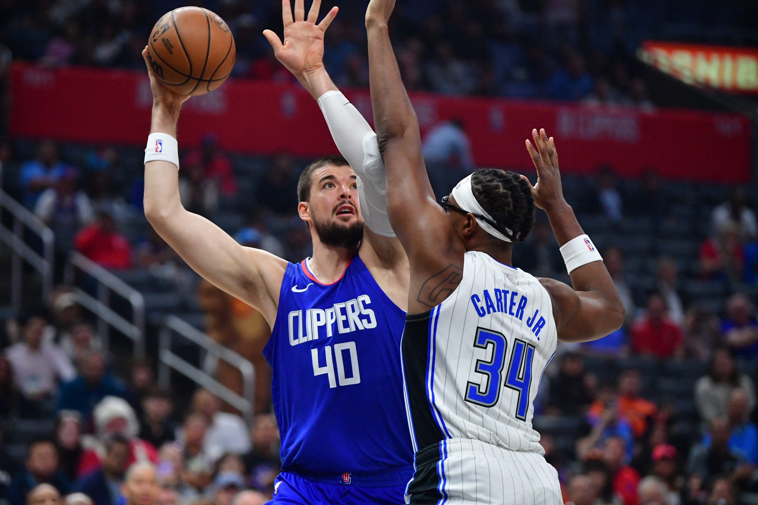 Oct 31, 2023; Los Angeles, California, USA;  Los Angeles Clippers center Ivica Zubac (40) shoots against Orlando Magic center Wendell Carter Jr. (34) during the first half at Crypto.com Arena. Mandatory Credit: Gary A. Vasquez-USA TODAY Sports Photo: Gary A. Vasquez/REUTERS
