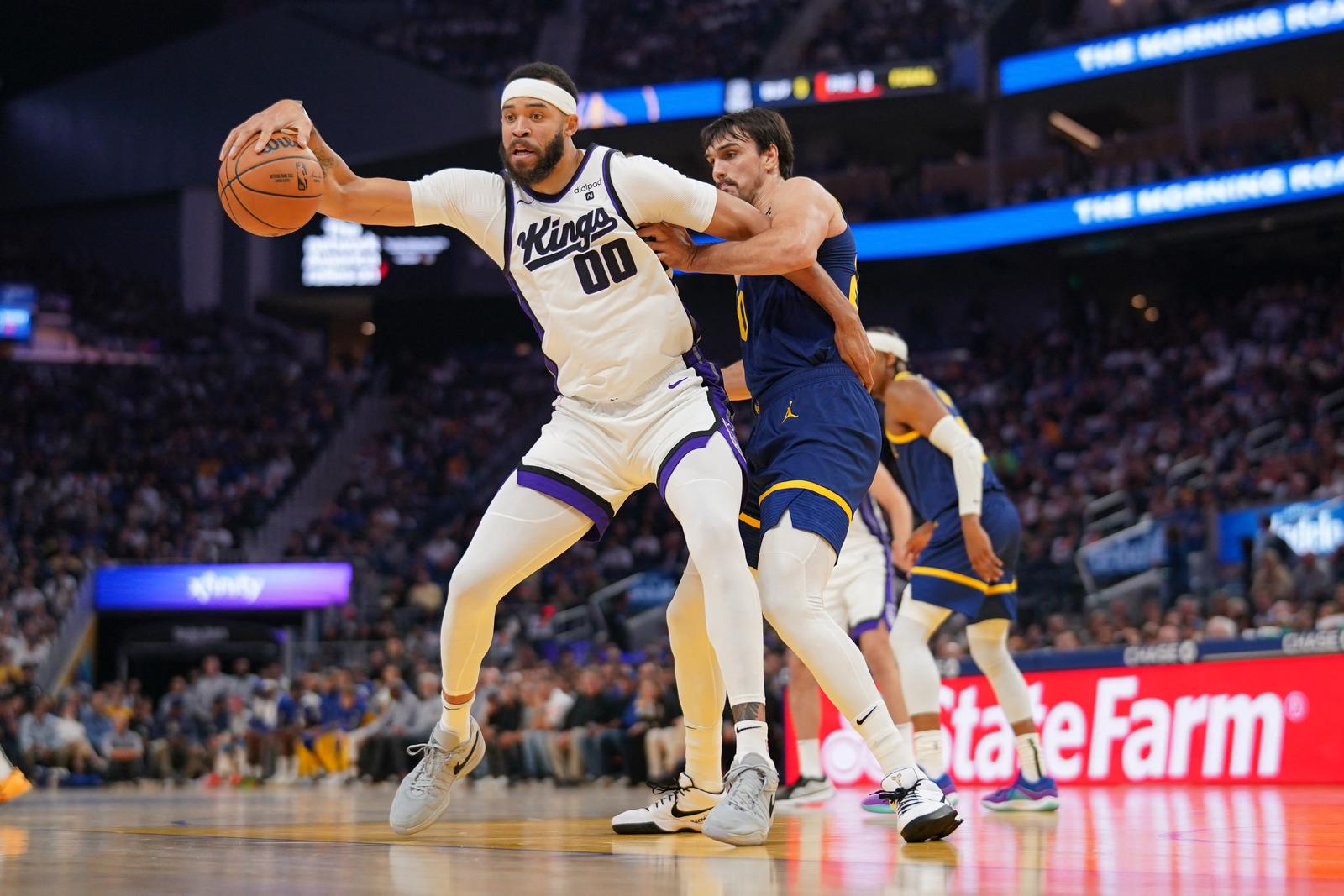 Nov 1, 2023; San Francisco, California, USA; Sacramento Kings center JaVale McGee (00) dribbles the ball in front of Golden State Warriors forward Dario Saric (20) in the first quarter at the Chase Center. Mandatory Credit: Cary Edmondson-USA TODAY Sports Photo: Cary Edmondson/REUTERS