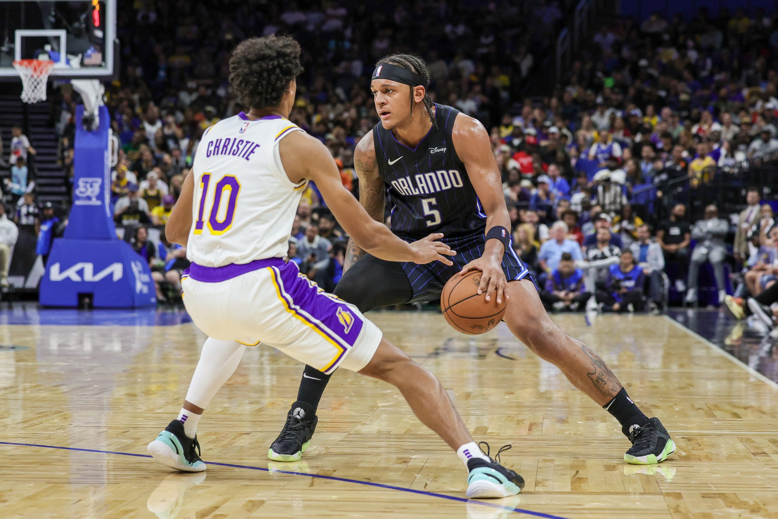 Nov 4, 2023; Orlando, Florida, USA; Orlando Magic forward Paolo Banchero (5) handles the ball in front of Los Angeles Lakers guard Max Christie (10) during the second half at Amway Center. Mandatory Credit: Mike Watters-USA TODAY Sports Photo: Mike Watters/REUTERS