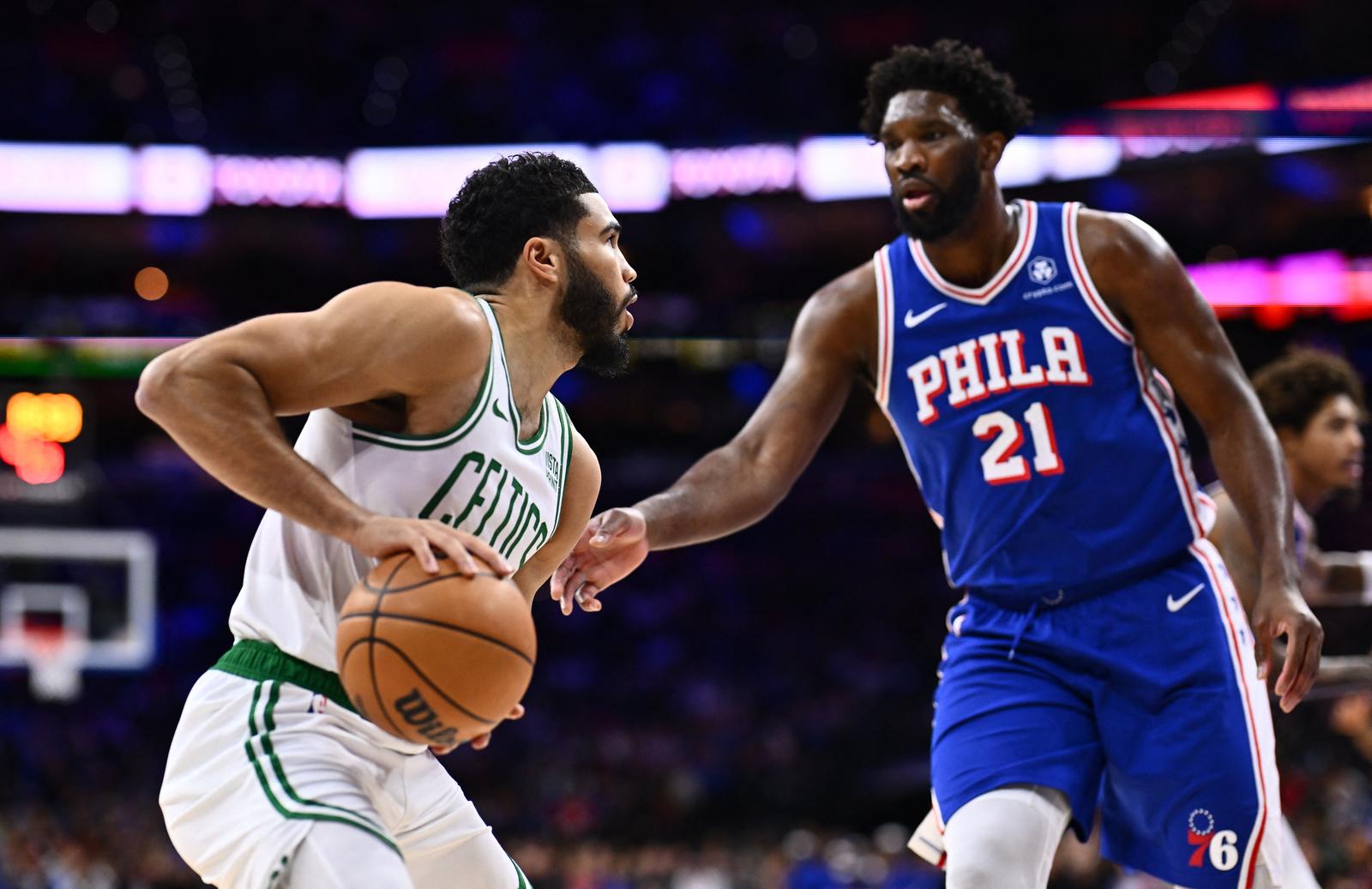 Nov 8, 2023; Philadelphia, Pennsylvania, USA; Boston Celtics forward Jayson Tatum (0) controls the ball against Philadelphia 76ers center Joel Embiid (21) in the first quarter at Wells Fargo Center. Mandatory Credit: Kyle Ross-USA TODAY Sports Photo: Kyle Ross/REUTERS