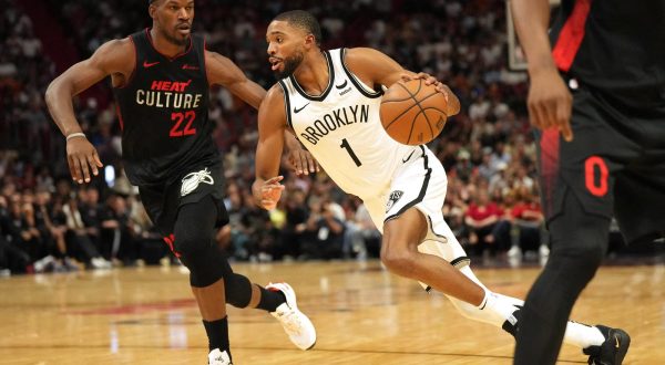 Nov 16, 2023; Miami, Florida, USA;  Brooklyn Nets forward Mikal Bridges (1) drives to the basket as Miami Heat forward Jimmy Butler (22) defends in the second half at Kaseya Center. Mandatory Credit: Jim Rassol-USA TODAY Sports Photo: Jim Rassol/REUTERS