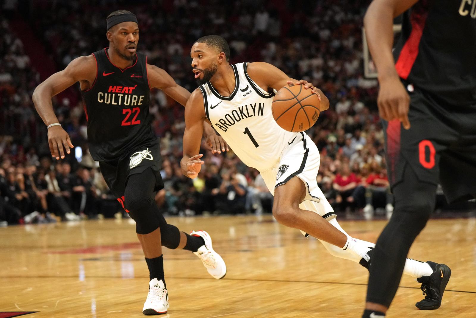 Nov 16, 2023; Miami, Florida, USA;  Brooklyn Nets forward Mikal Bridges (1) drives to the basket as Miami Heat forward Jimmy Butler (22) defends in the second half at Kaseya Center. Mandatory Credit: Jim Rassol-USA TODAY Sports Photo: Jim Rassol/REUTERS