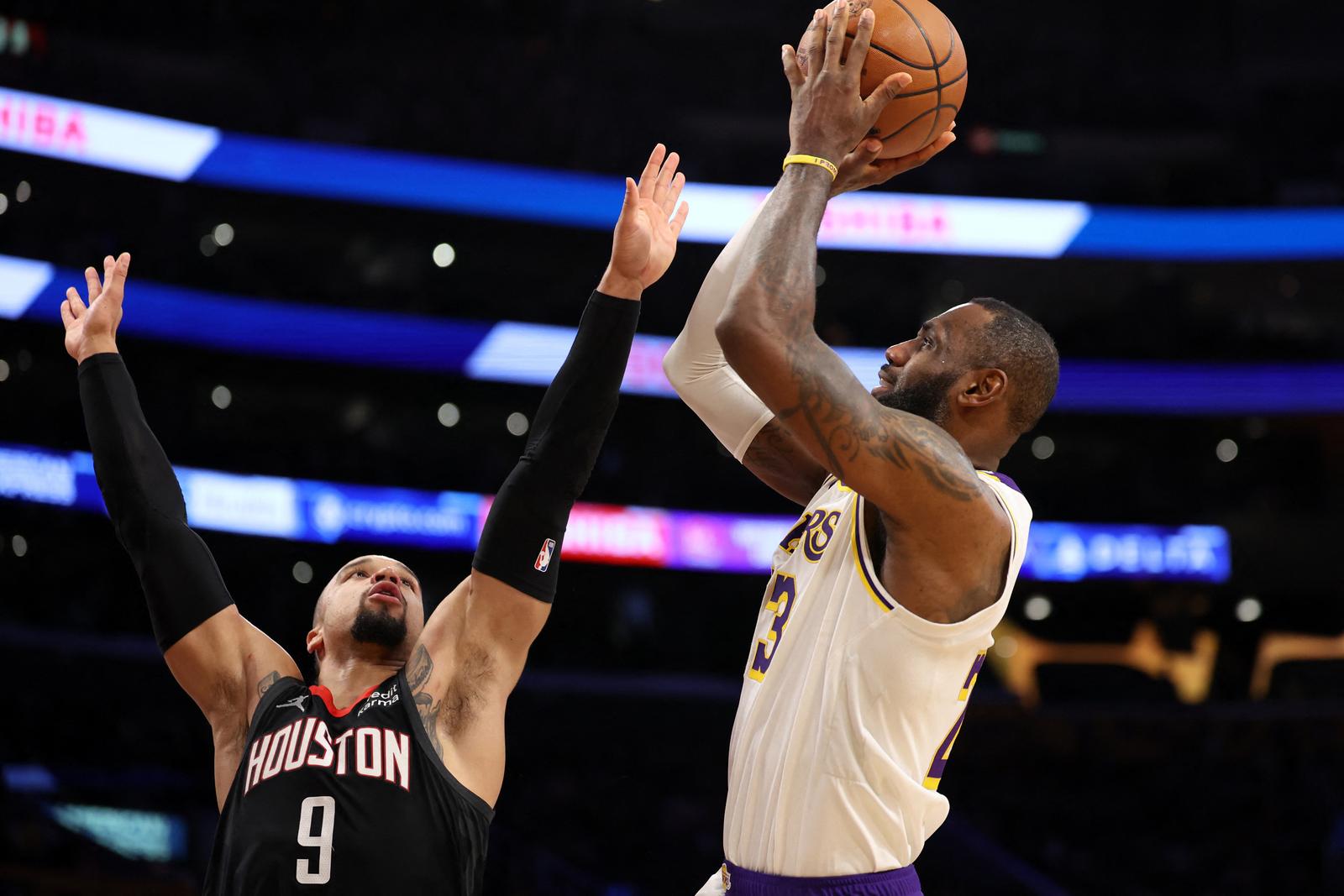 Nov 19, 2023; Los Angeles, California, USA;  Los Angeles Lakers forward LeBron James (23) shoots over Houston Rockets forward Dillon Brooks (9) during the second quarter at Crypto.com Arena. Mandatory Credit: Kiyoshi Mio-USA TODAY Sports Photo: Kiyoshi Mio/REUTERS