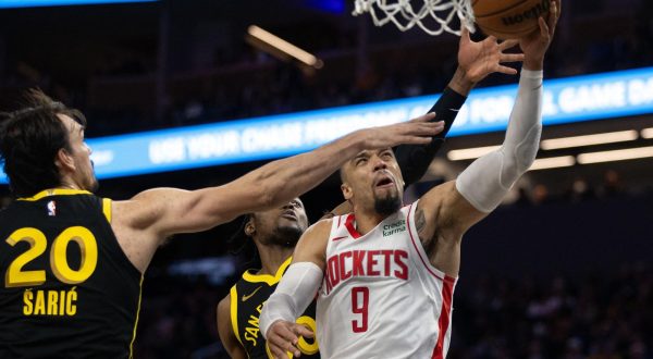 Nov 20, 2023; San Francisco, California, USA; Houston Rockets guard Dillon Brooks (9) drives against Golden State Warriors center Dario Saric (20) and forward Jonathan Kuminga (00) during the third quarter at Chase Center. Mandatory Credit: D. Ross Cameron-USA TODAY Sports Photo: D. Ross Cameron/REUTERS