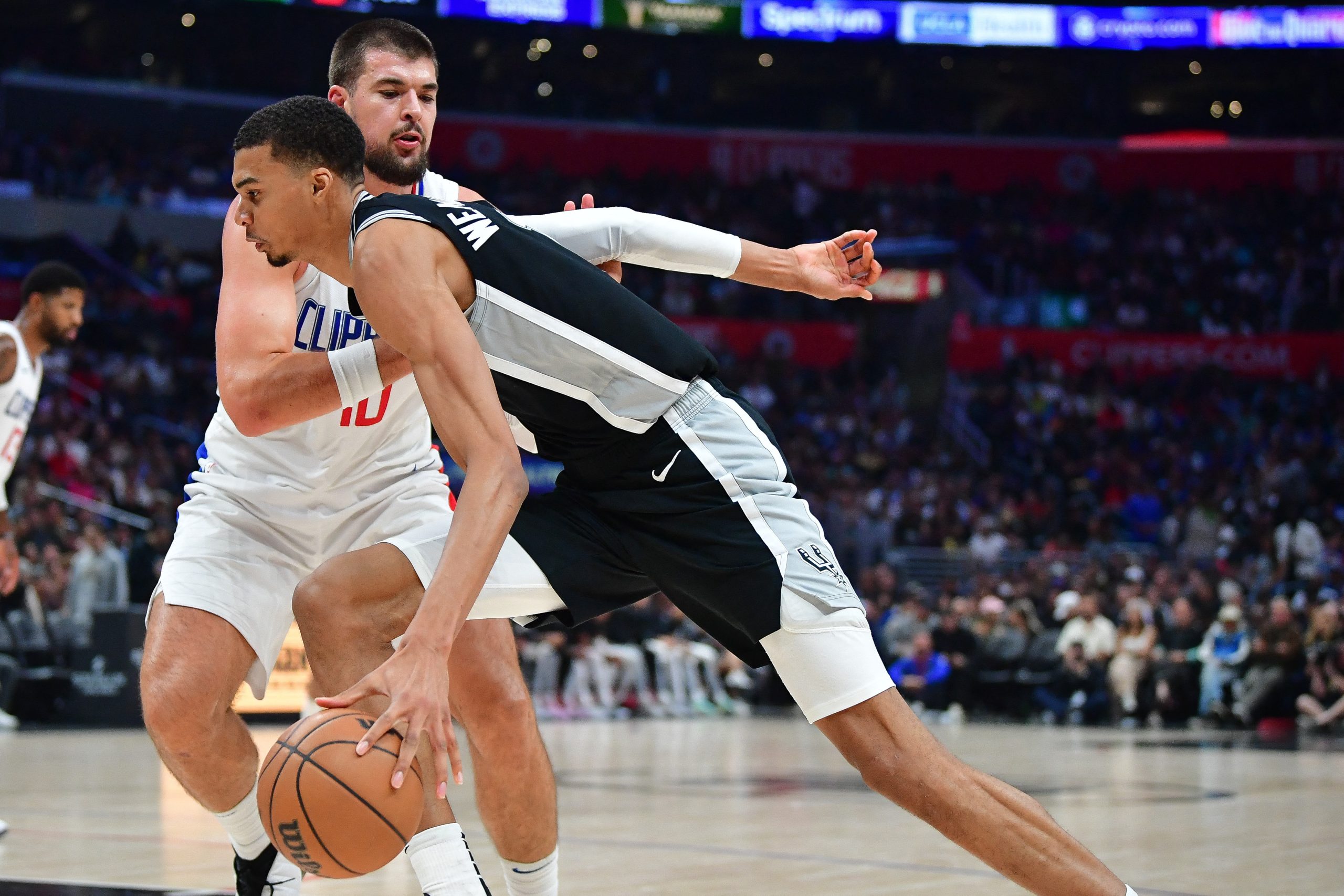 Oct 29, 2023; Los Angeles, California, USA; San Antonio Spurs center Victor Wembanyama (1) moves the ball against Los Angeles Clippers center Ivica Zubac (40) during the second half at Crypto.com Arena. Mandatory Credit: Gary A. Vasquez-USA TODAY Sports Photo: Gary A. Vasquez/REUTERS