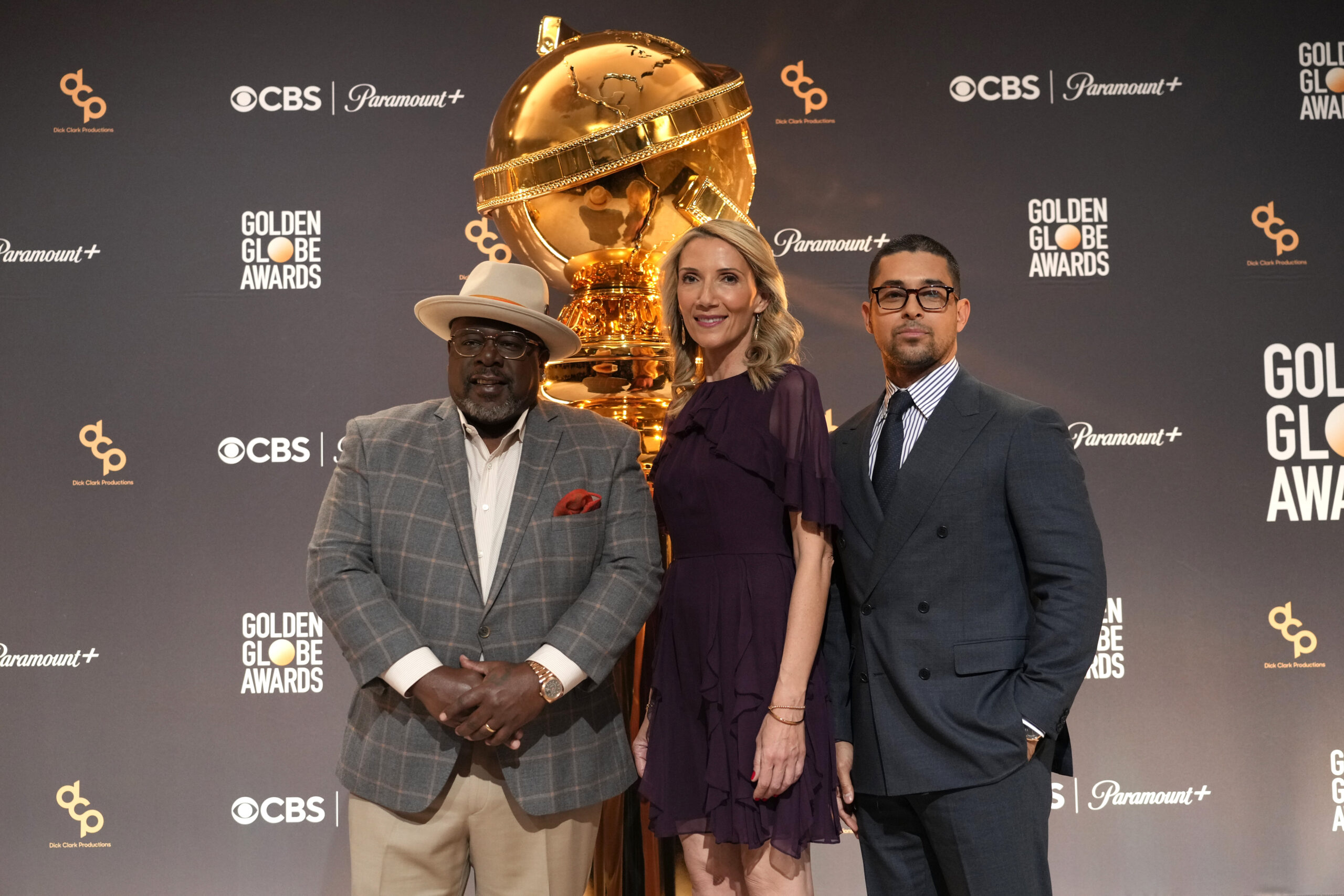 Cedric the Entertainer, from left, Helen Hoehne, president of Golden Globes LLC., and Wilmer Valderrama appear at the nominations for the 81st Golden Globe Awards at the Beverly Hilton Hotel on Monday, Dec. 11, 2023, in Beverly Hills, Calif. The 81st Golden Globe Awards will be held on Sunday, Jan. 7, 2024. (AP Photo/Chris Pizzello)