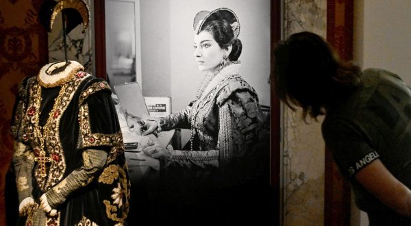 epa10978463 A visitor looks at installations in the 'Fantasmagoria Callas' exhibition set up in rooms of the Scala Theater Museum in Milan, Italy, 16 November 2023. The exhibition, that runs from 17 November to 24 April 2024, tells the story that Maria Callas left in the imagination of artists as Giorgio Armani, Alvin Curran, Francesco Vezzoli, Latifa Echakhch and Mario Martone.  EPA/Daniel Dal Zennaro