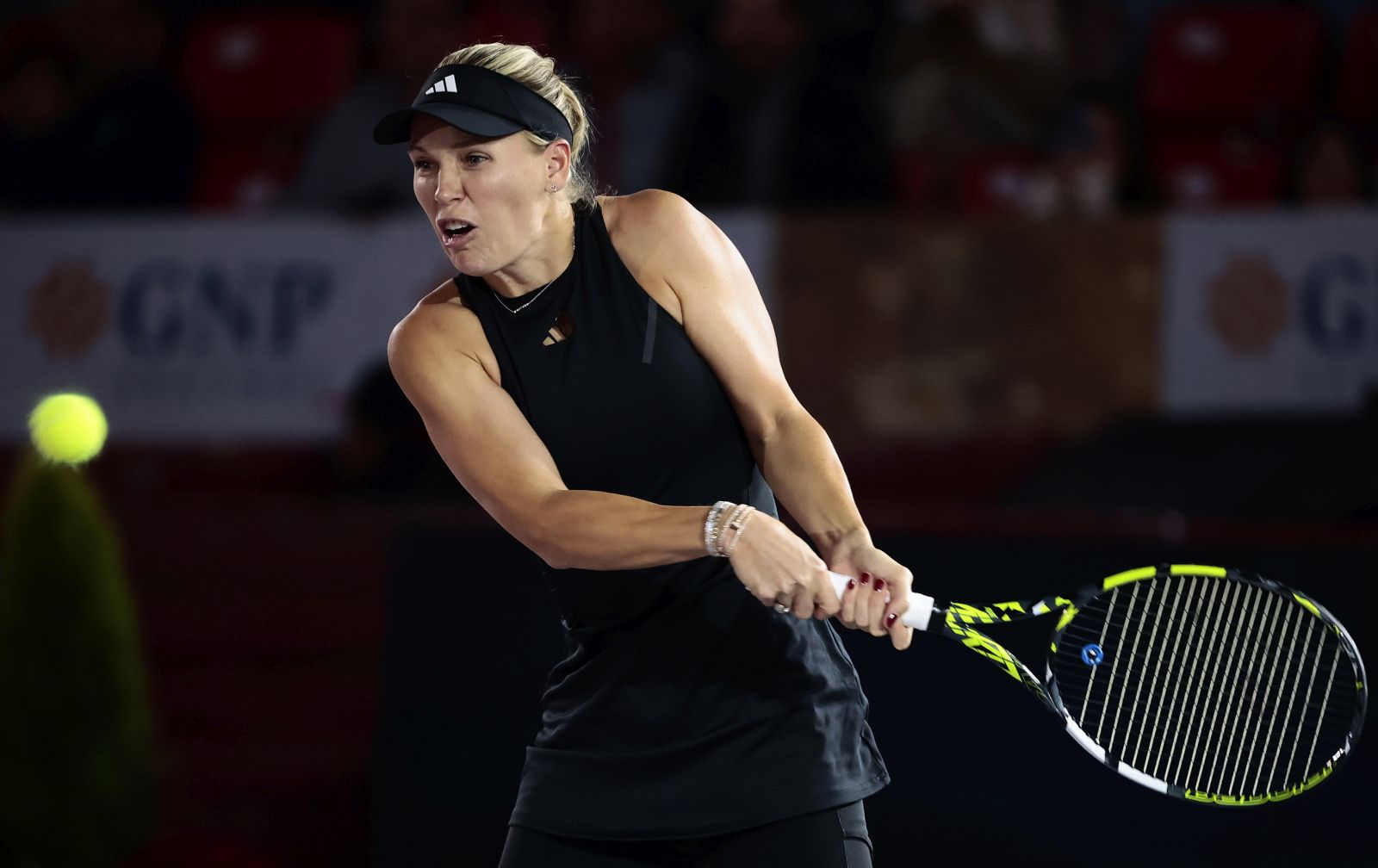 epa11002714 Danish tennis player Caroline Wozniacki in action against Greek Maria Sakkari during an exhibition match at the Tennis Fest, held at the Plaza de Toros Mexico in Mexico City, Mexico, 29 November 2023.  EPA/Jose Mendez