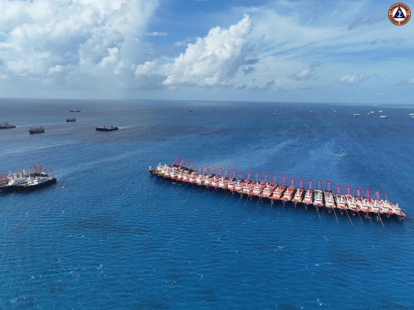 epa11008770 A handout photo made available by the Philippine Coast Guard (PCG) shows an aerial view of Chinese vessels gathering in Whitsun Reef, west of Palawan Island, Philippines, in the disputed waters of the South China Sea, 02 December 2023 (issued 03 December 2023). According to the Philippine Coast Guard (PCG), more than 135 Chinese maritime vessels were monitored in the vicinity of Whitsun Reef, describing the growing presence of Chinese vessels in the reef as an 'alarming development'.  EPA/PCG HANDOUT  HANDOUT EDITORIAL USE ONLY/NO SALES HANDOUT EDITORIAL USE ONLY/NO SALES