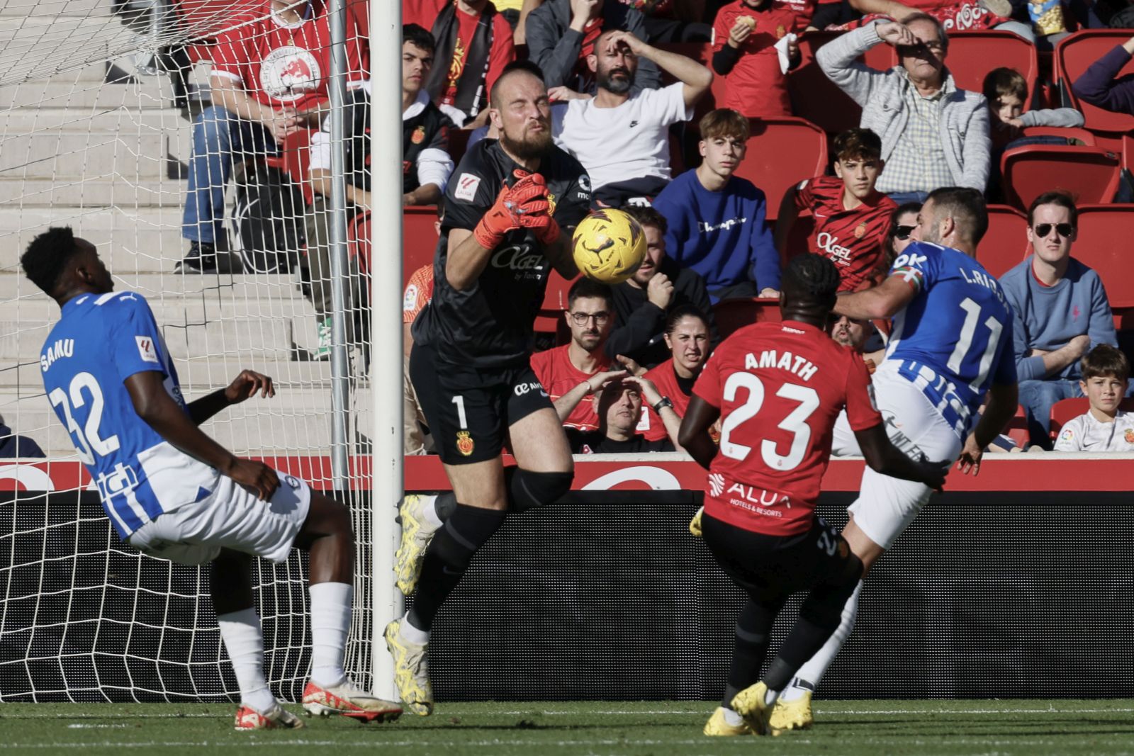 epa11008898 Real Mallorca's goalkeeper Predrag Rajkovic (2L) makes a save during a Spanish LaLiga EA Sports match between Deportivo Alaves and Real Mallorca at Son Moix stadium in Mallorca, Baleares Islands, 03 December 2023.  EPA/Cati Cladera
