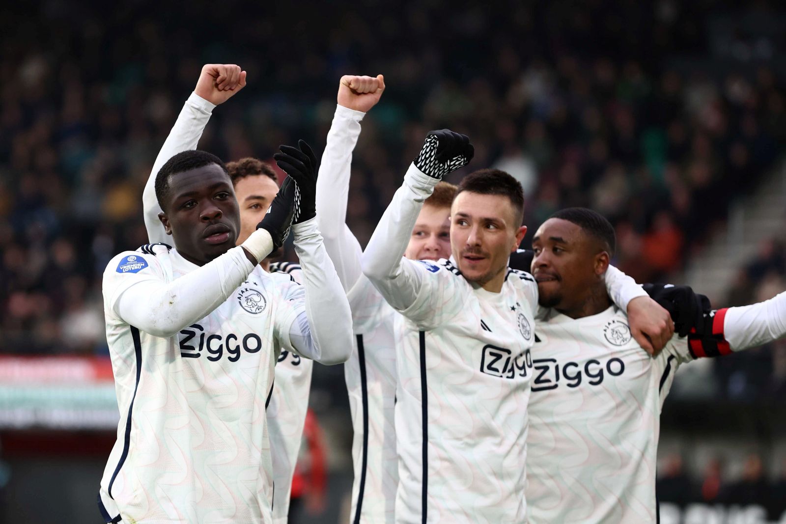 epa11009178 (L-R) Brian Brobbey, Steven Berghuis and Steven Bergwijn of Ajax celebrate the opening goal during the Dutch Eredivisie match between NEC and Ajax in Nijmegen, Netherlands, 03 December 2023.  EPA/VINCENT JANNINK