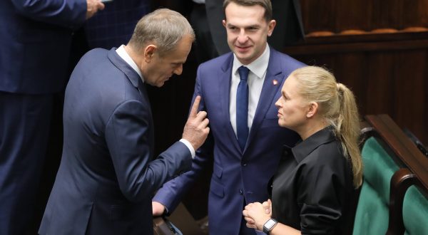 epa11022676 Civic Platform party (PO) leader Donald Tusk (L) talks to deputies Adam Szlapka (C) and Barbara Nowacka (R) at the Sejm hall, the lower house of the Polish parliament, in Warsaw, Poland, 11 December 2023. Prime Minister Morawiecki on 11 December will present the agenda of the Council of Ministers with a motion for a vote of confidence. According to the Sejm website, the vote of confidence in Mateusz Morawiecki's government will be followed by a one and a half hour break, during which candidacies for the so-called Prime Minister will be submitted. A candidate for prime minister can be proposed by a group of at least 46 MPs.  EPA/PAWEL SUPERNAK POLAND OUT