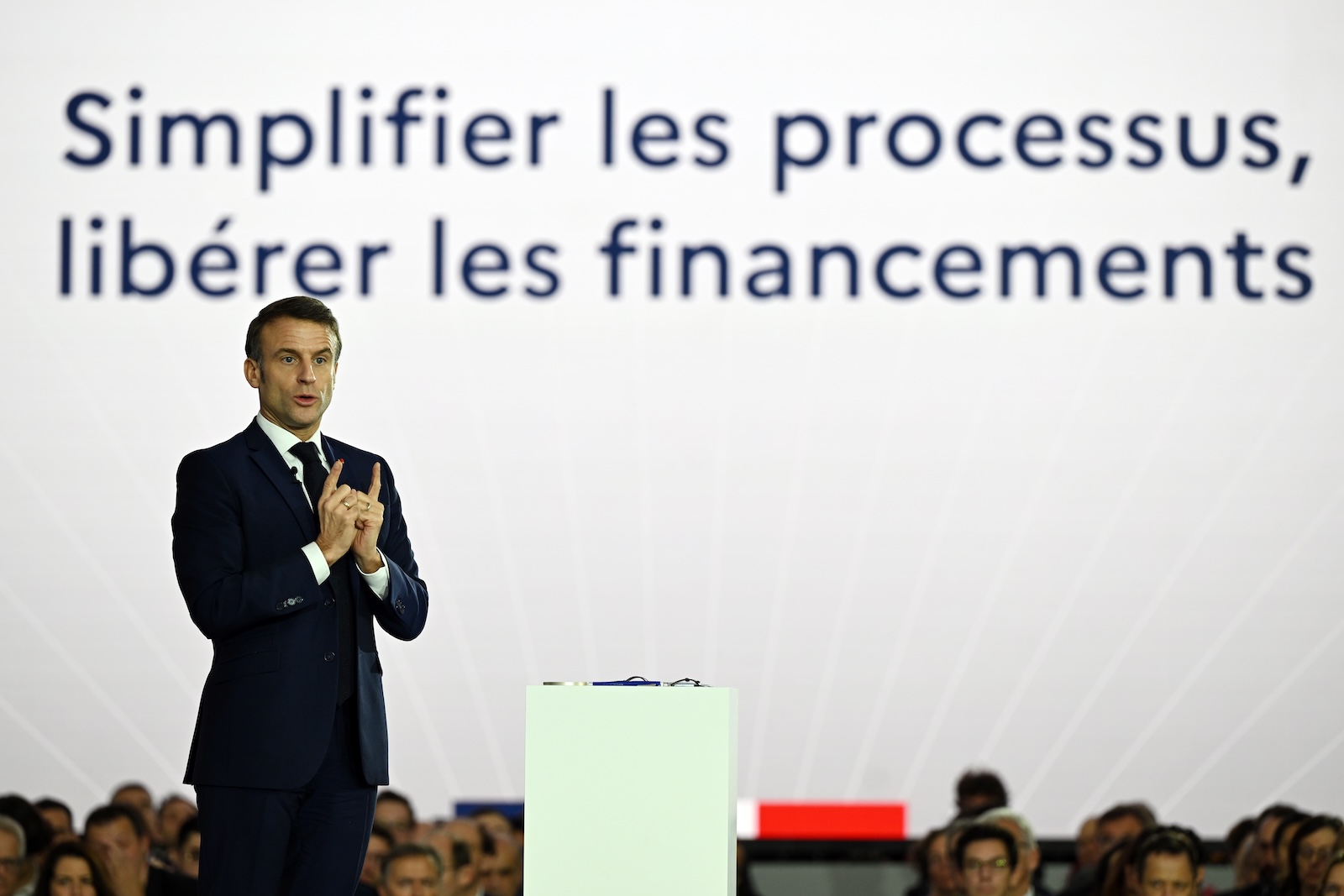 epa11023005 French President Emmanuel Macron delivers a speech as he visits Airbus site in Toulouse to follow up on France 2030 industrial investment plan, in Toulouse, France, 11 December 2023. The France 2030 plan was launched in October 2023 to increase France's competitiveness in key industrial and technological sectors.  EPA/Caroline Blumberg / POOL
