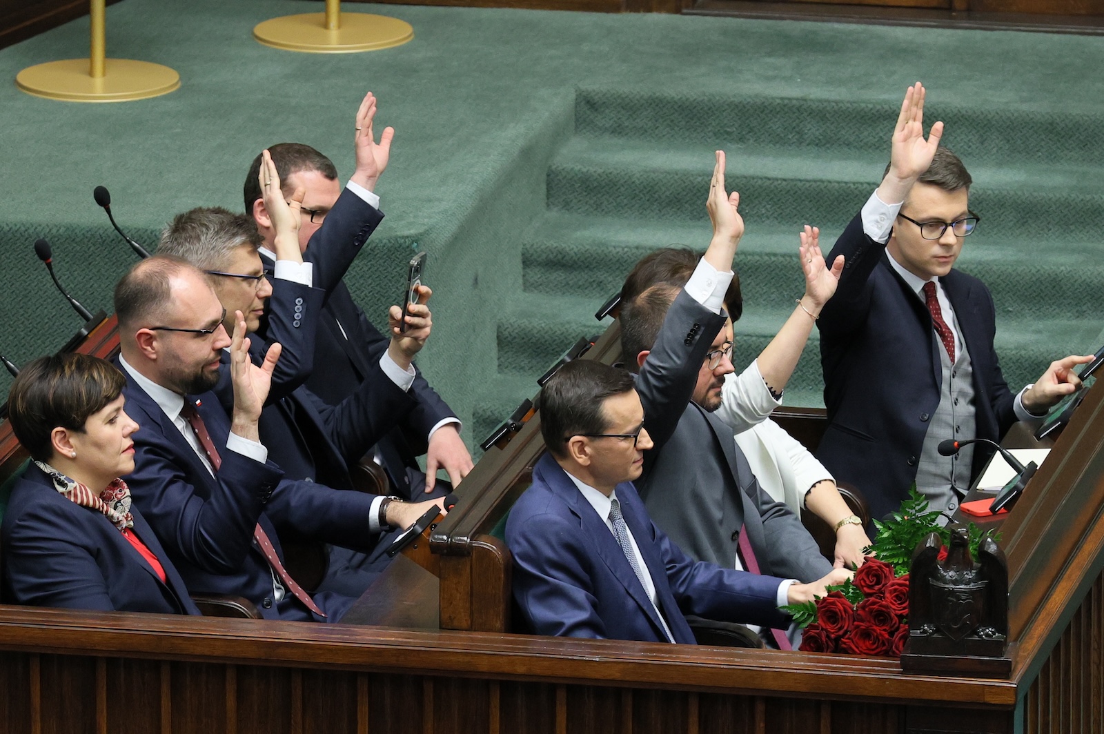epa11023126 Members of the Polish Law and Justice government vote of confidence on Mateusz Morawiecki's (C) government at the Sejm, the lower house of parliament, in Warsaw, Poland, 11 December 2023. Polish Law and Justice government has lost a vote of confidence in the Sejm, the lower house of parliament. There were 190 votes in favour of the government led by Mateusz Morawiecki, 266 votes against and no abstentions. The Sejm will now appoint a new candidate for prime minister, which will almost certainly be Donald Tusk, the candidate put forward by the Civic Coalition, the Third Way and the Left.  EPA/PAWEL SUPERNAK POLAND OUT