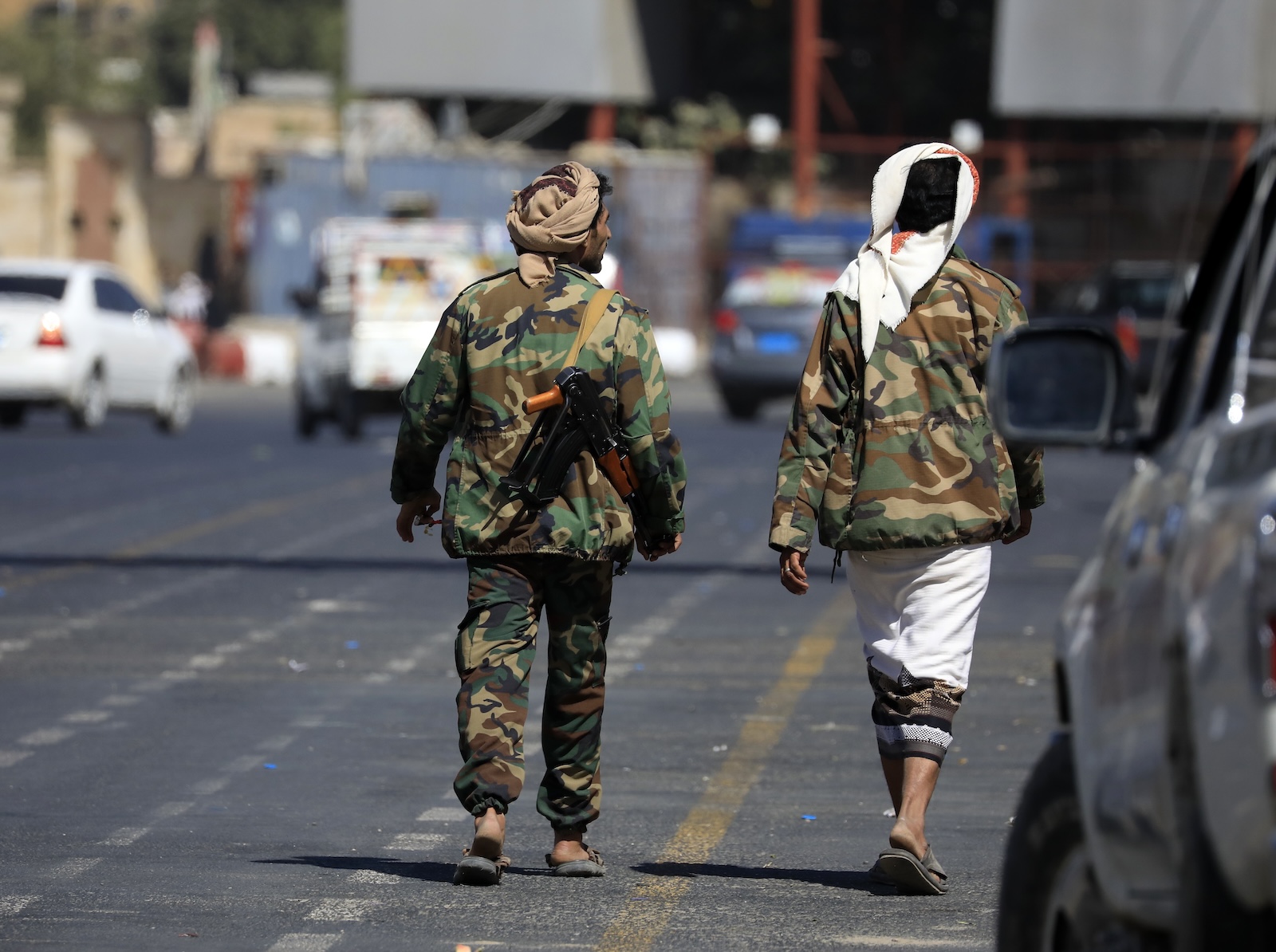epa11024188 Houthi fighters walk through a street in Sana'a, Yemen, 12 December 2023. Yemen's Houthis claimed a missile attack against a Norwegian tanker off Yemen in the Red Sea, days after they pledged to target Israel-bound ships of any nationality, amid an escalation of their attacks and hijackings of commercial ships in the Red Sea in retaliation for Israel's airstrikes on the Gaza Strip. Thousands of Israelis and Palestinians have died since the militant group Hamas launched an unprecedented attack on Israel from the Gaza Strip on 07 October, and the Israeli strikes on the Palestinian enclave which followed it.  EPA/YAHYA ARHAB