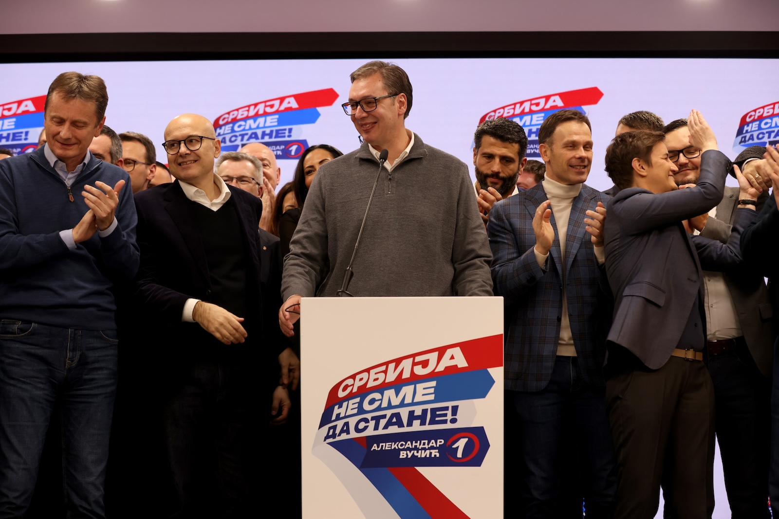 epa11035209 Serbian President Aleksandar Vucic (C) addresses the media at the SNS election night after the Parliamentary and local elections in Belgrade, Serbia, 17 December 2023. Serbian Prime Minister Ana Brnabic announced to the media that the Serbian Progressive Party SNS had won the parliamentary election in Serbia and secured a majority in the Parliament, based on 50 percent of exit polls.  EPA/ANDREJ CUKIC