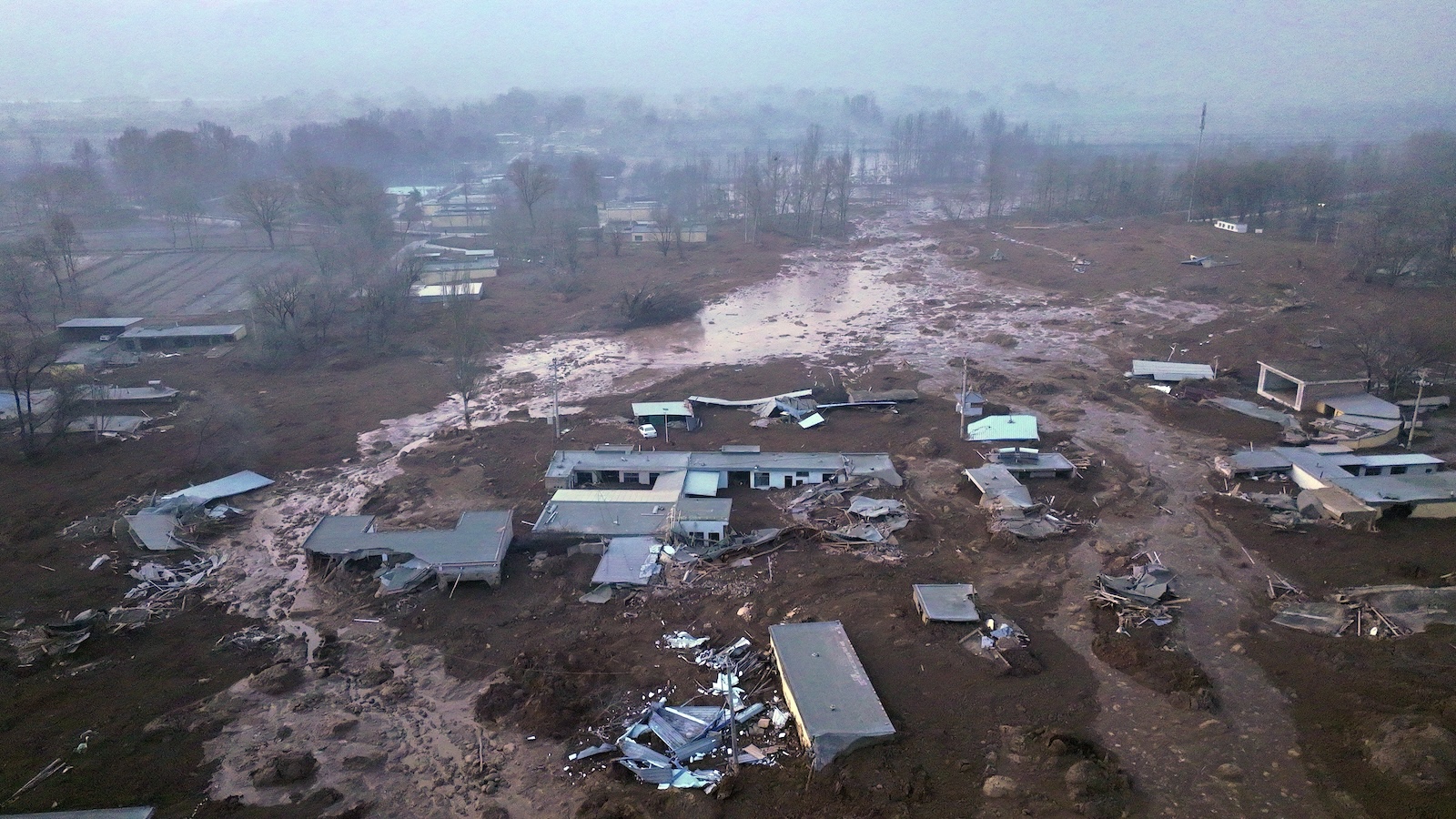 epa11036709 An aerial photo shows the mudslide-struck Caotan Village in Minhe Hui and Tu Autonomous County of Haidong City, Qinghai Province, China, 19 December 2023. Eleven people have been confirmed dead in northwest China's Qinghai Province, after a 6.2-magnitude earthquake jolted the neighboring Gansu Province late Monday evening, according to local authorities. The epicenter was located just 5 km from the border between the two provinces. Many areas in Qinghai have felt strong tremors.  The United States Geological Survey (USGS) listed an alternate reading of 5.9 magnitude for the earthquake.  EPA/XINHUA / Zhang Hongxiang CHINA OUT / UK AND IRELAND OUT  /       MANDATORY CREDIT  EDITORIAL USE ONLY  EDITORIAL USE ONLY  EDITORIAL USE ONLY