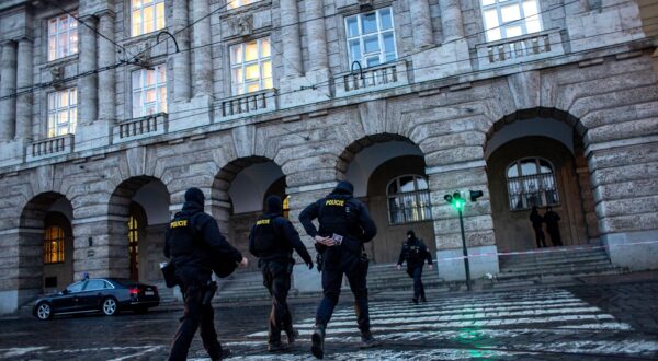 epa11040534 Police officers patrol following a mass shooting at one building of the Charles University in central Prague, Czech Republic, 22 December 2023. According to the Czech Police President Martin Vondrasek, there are at least 14 people dead and 25 injured after the shooting at the Charles University on 21 December. According to Czech police the perpetrator was a 24 year-old Charles University student, who is also suspected of killing his father.  EPA/MARTIN DIVISEK