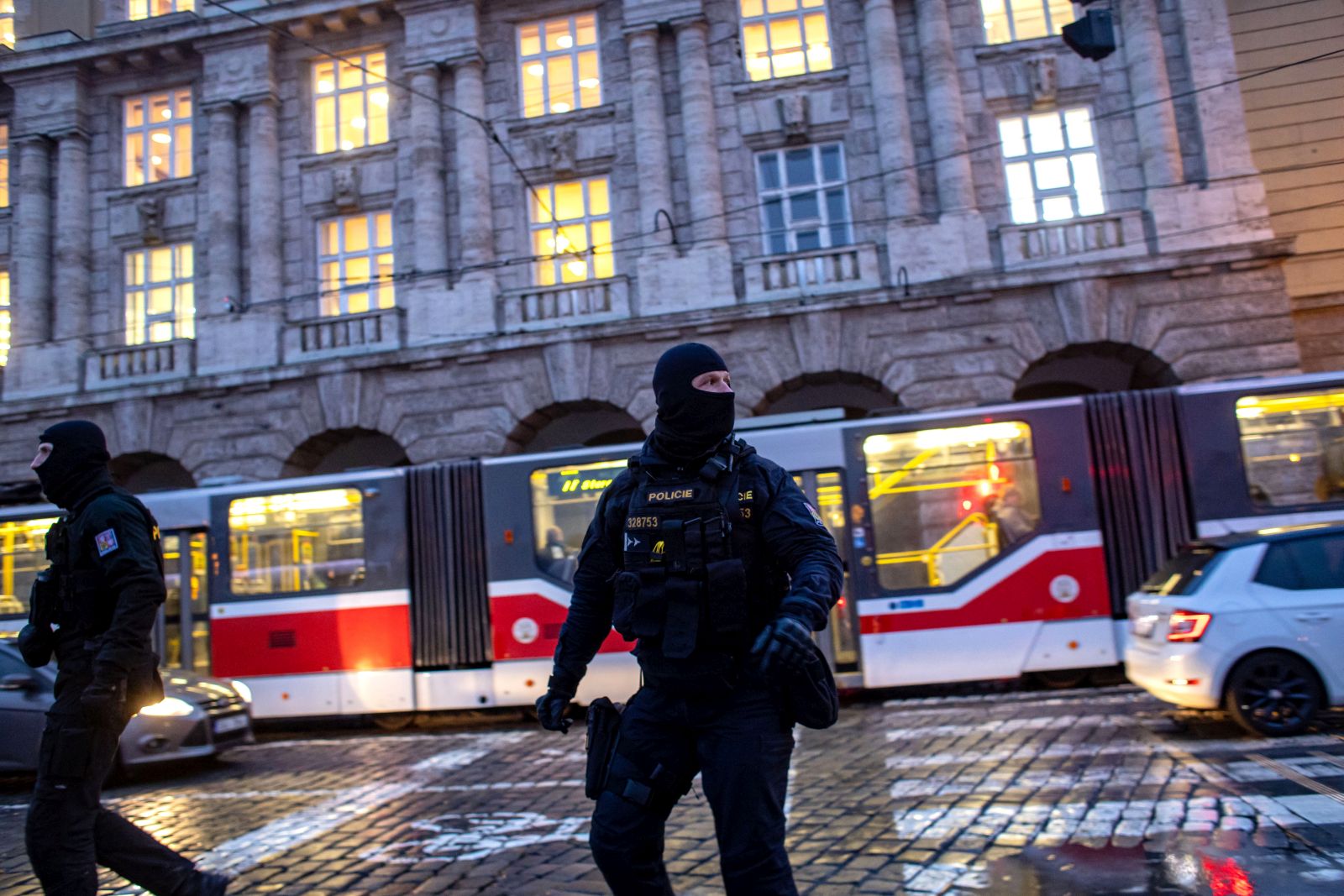 epa11040533 Police officers patrol following a mass shooting at one building of the Charles University in central Prague, Czech Republic, 22 December 2023. According to the Czech Police President Martin Vondrasek, there are at least 14 people dead and 25 injured after the shooting at the Charles University on 21 December. According to Czech police the perpetrator was a 24 year-old Charles University student, who is also suspected of killing his father.  EPA/MARTIN DIVISEK