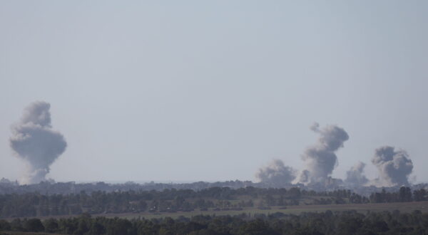 epa11044584 Smoke rises above Al-Bureij refugee camp in the central Gaza Strip following Israeli army shelling, as seen from an undisclosed location at the Gaza border, Israel, 26 December 2023. More than 20,000 Palestinians and at least 1,300 Israelis have been killed, according to the Palestinian Health Ministry and the Israel Defense Forces (IDF), since Hamas militants launched an attack against Israel from the Gaza Strip on 07 October, and the Israeli operations in Gaza and the West Bank which followed it.  EPA/ATEF SAFADI