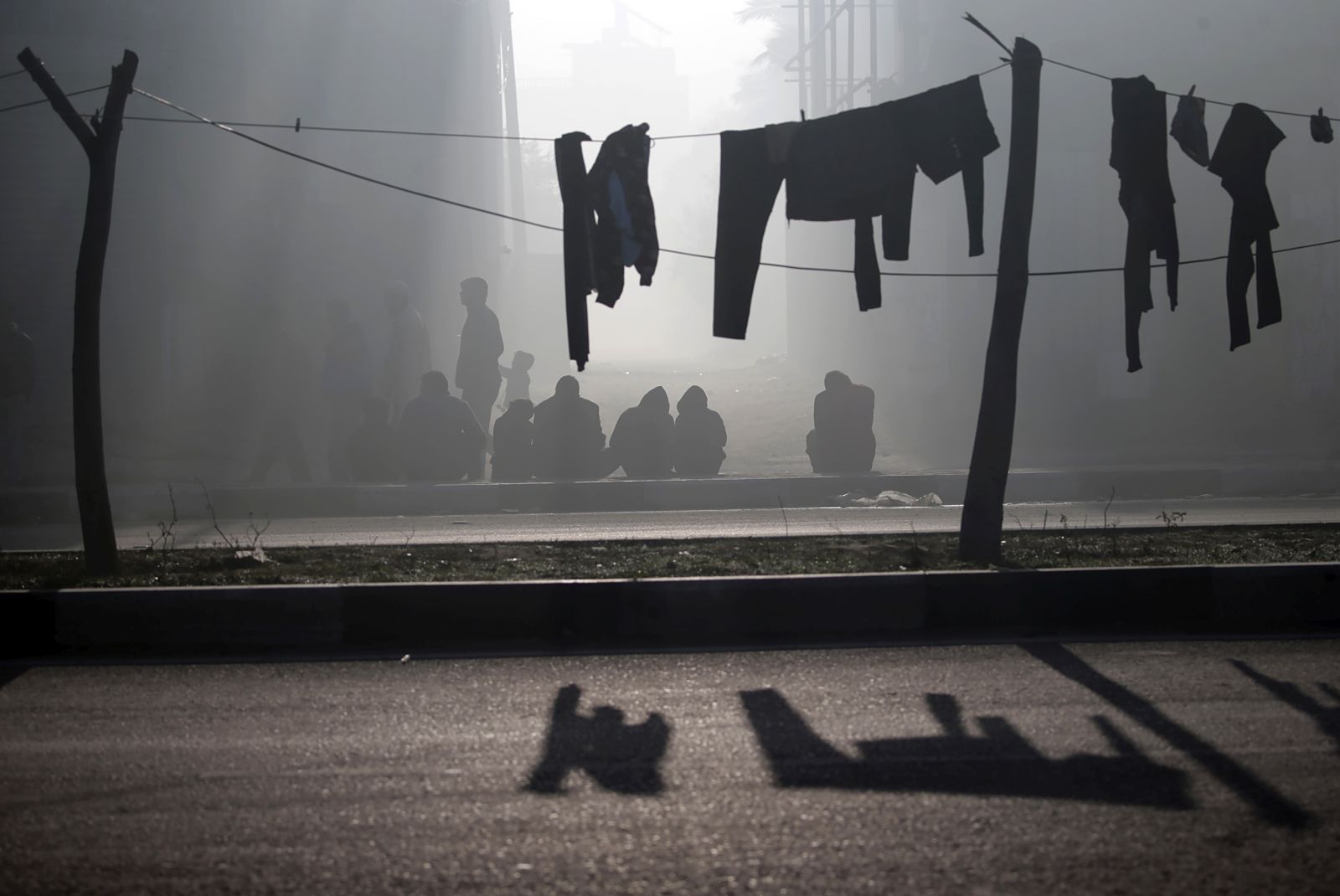 epa11045368 Clothes hang on a wire as residents of Al Nusairat and Al Bureij refugee camps wait to evacuate following an Israeli warning of increased military operations in the camps in the Gaza strip, 26 December 2023 (issued 27 December 2023). Since 07 October, up to 1.9 million people, or more than 85 percent of the population, have been displaced throughout the Gaza Strip, some more than once, according to the United Nations Relief and Works Agency for Palestine Refugees in the Near East (UNRWA), which added that most civilians in Gaza are in 'desperate need of humanitarian assistance and protection'.  EPA/MOHAMMED SABER