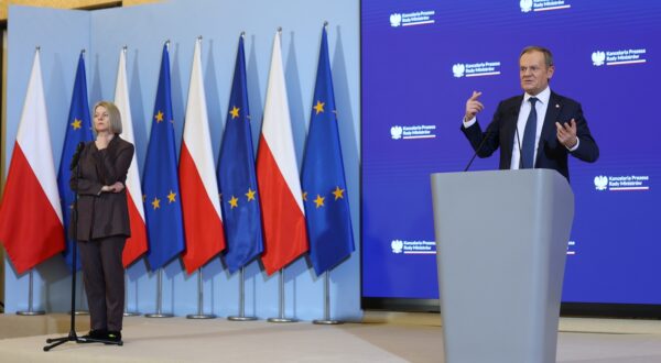 epa11045678 Polish Prime Minister Donald Tusk (R) speaks next to Agnieszka Rucinska (L) of the Civic Platform (PO) party press office, during a press conference after a meeting of the cabinet at the prime minister's office in Warsaw, Poland, 27 December 2023. The government will prepare a new budget-related bill 'after the president's veto', Donald Tusk announced at a press conference. Polish President Andrzej Duda vetoed the government's budget-related bill on 23 December, saying the veto was caused by 'a blatant violation of the Constitution and the principles of a democratic rule of law,' in reference to the government's sweeping management changes at state-owned media companies.  EPA/LESZEK SZYMANSKI POLAND OUT