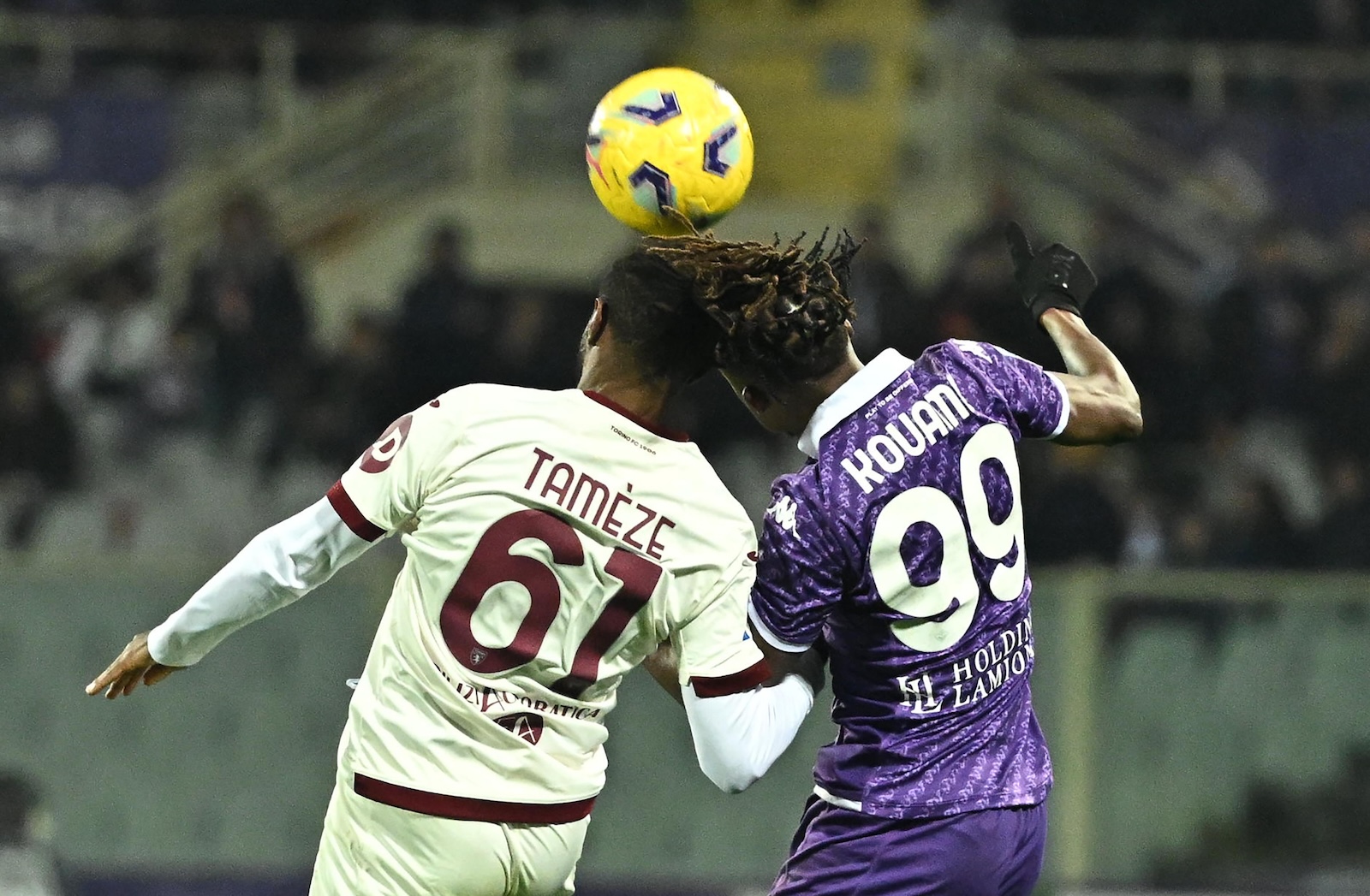 epa11048506 Fiorentina's forward Christian Kouame (R) in action against Torino's midfielder Adrien Tameze during the Italian Serie A soccer match ACF Fiorentina vs Torino FC at Artemio Franchi Stadium in Florence, Italy, 29 December 2023.  EPA/CLAUDIO GIOVANNINI
