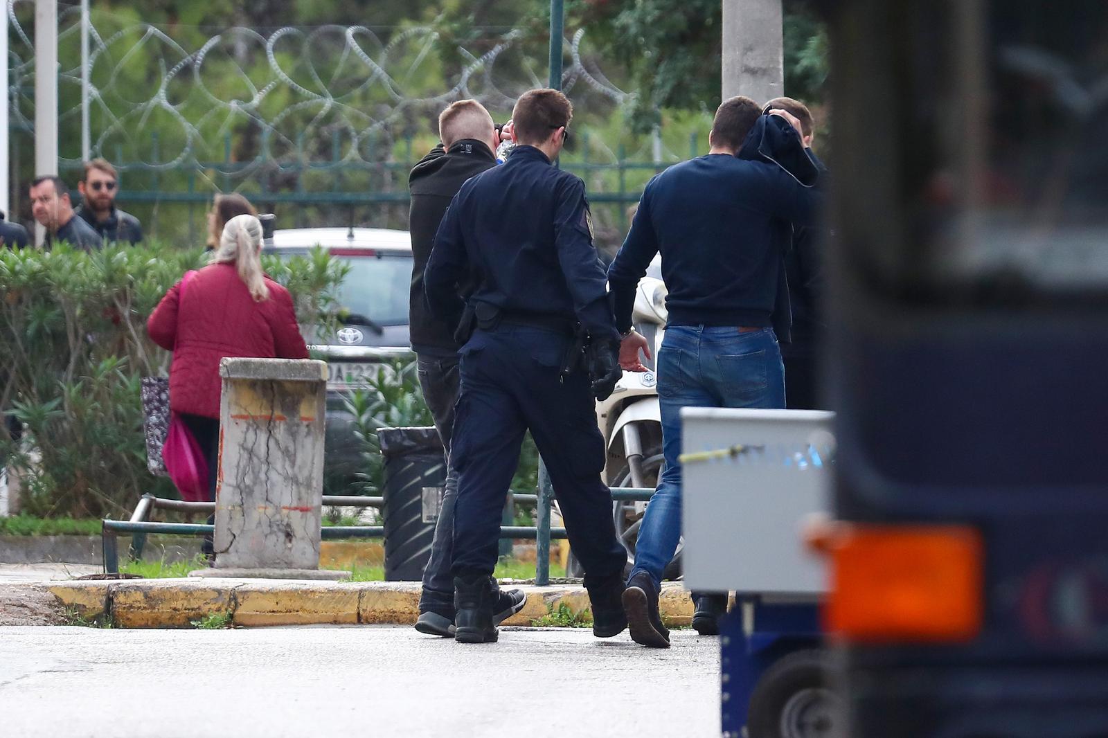 06.12.2023., Atena, Grcka - Policija dovodi na sud navijace Dinama, Bad Blue Boyse. Photo: Matija Habljak/PIXSELL