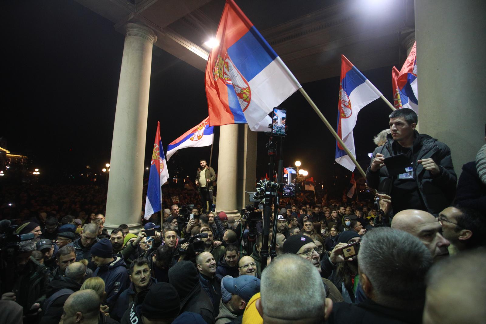24, December, 2023, Belgrade -  TSupporters of the coalition "Serbia against violence" (SPN), who started the protest in front of the Republican Electoral Commission, have formed a ring around the building of the Belgrade City Assembly and are trying to get inside.    

24, decembar, 2023, Beograd - Pristalice koalicije "Srbija protiv nasilja" (SPN) koje su zapocele protest ispred Republicke izborne komisije su napoziv predstavnika koalicije napravili prsten oko zgrade Skupstine grada Beograda i pokusavaju da udju unutra.     Photo: Milos Tesic/ATAImages/PIXSELL