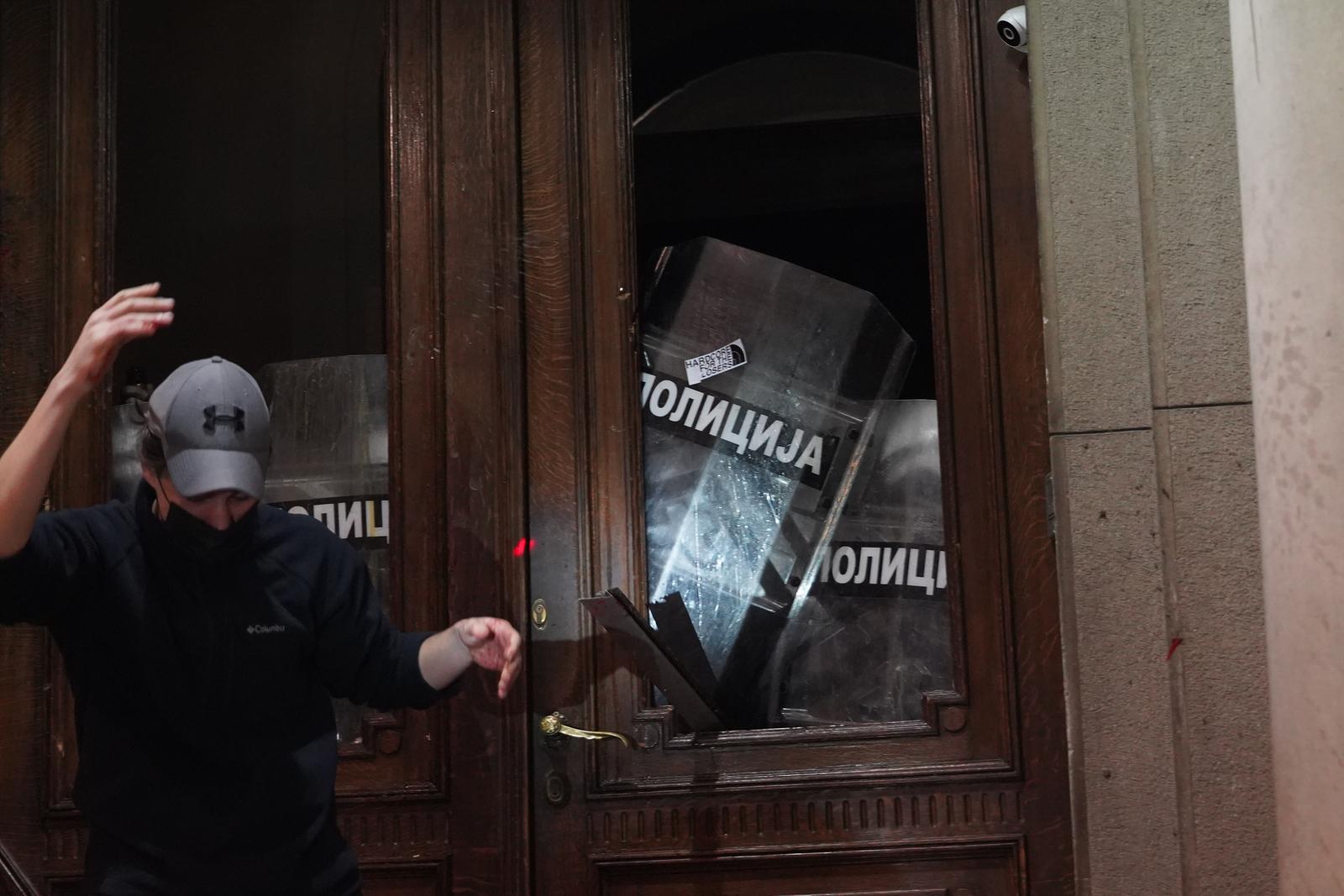24, December, 2023, Belgrade -  Supporters of the coalition "Serbia against violence", who started the protest in front of the Republican Election Commission, at the invitation of the representatives of the coalition, made a ring around the building of the Assembly of the City of Belgrade and are trying to get inside.  Photo: Antonio Ahel/ATAImages

24, decembar, 2023, Beograd - Pristalice koalicije "Srbija protiv nasilja" koje su zapocele protest ispred Republicke izborne komisije su napoziv predstavnika koalicije napravili prsten oko zgrade Skupstine grada Beograda i pokusavaju da udju unutra. Photo: Antonio Ahel/ATAImages Photo: Antonio Ahel/ATAImages/PIXSELL