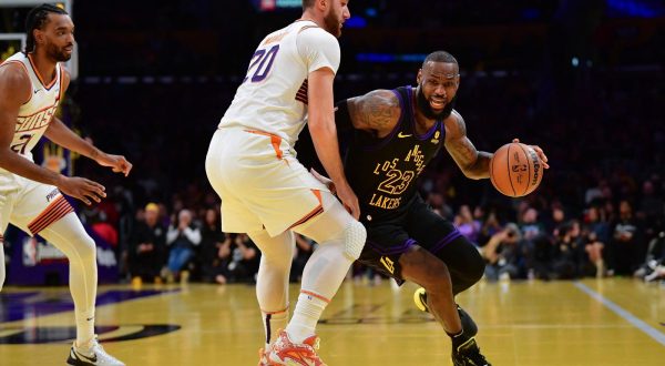 Dec 5, 2023; Los Angeles, California, USA; Los Angeles Lakers forward LeBron James (23) moves the ball against Phoenix Suns center Jusuf Nurkic (20) during the first half of the In Season Tournament quarterfinal at Crypto.com Arena. Mandatory Credit: Gary A. Vasquez-USA TODAY Sports Photo: Gary A. Vasquez/REUTERS