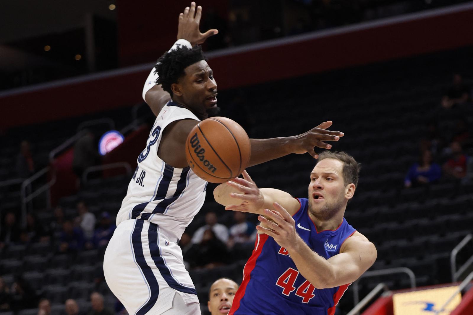 Dec 6, 2023; Detroit, Michigan, USA;  Detroit Pistons forward Bojan Bogdanovic (44) passes on Detroit Pistons center James Wiseman (13) in the first half at Little Caesars Arena. Mandatory Credit: Rick Osentoski-USA TODAY Sports Photo: Rick Osentoski/REUTERS