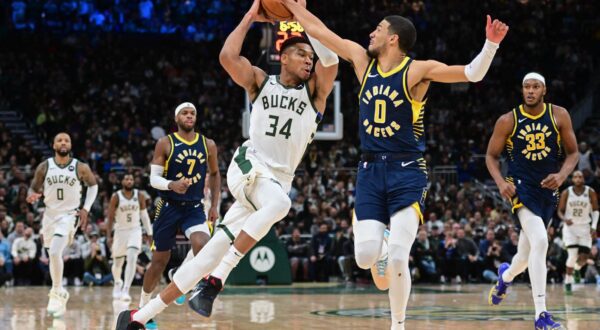 Dec 13, 2023; Milwaukee, Wisconsin, USA; Milwaukee Bucks forward Giannis Antetokounmpo (34) drives for the basket against Indiana Pacers guard Tyrese Haliburton (0) in the fourth quarter at Fiserv Forum. Mandatory Credit: Benny Sieu-USA TODAY Sports Photo: Benny Sieu/REUTERS