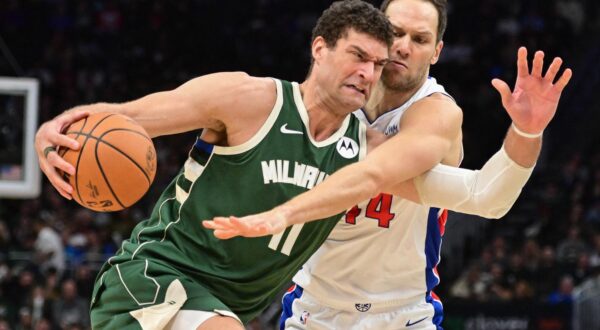 Dec 16, 2023; Milwaukee, Wisconsin, USA; Milwaukee Bucks center Brook Lopez (11) drives for the basket against Detroit Pistons forward Bojan Bogdanovic (44) in the third quarter at Fiserv Forum. Mandatory Credit: Benny Sieu-USA TODAY Sports Photo: Benny Sieu/REUTERS