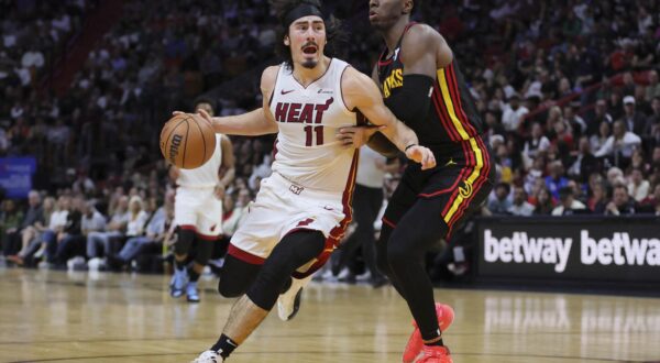 Dec 22, 2023; Miami, Florida, USA; Miami Heat guard Jaime Jaquez Jr. (11) drives to the basket against Atlanta Hawks forward Onyeka Okongwu (17) during the third quarter at Kaseya Center. Mandatory Credit: Sam Navarro-USA TODAY Sports Photo: Sam Navarro/REUTERS